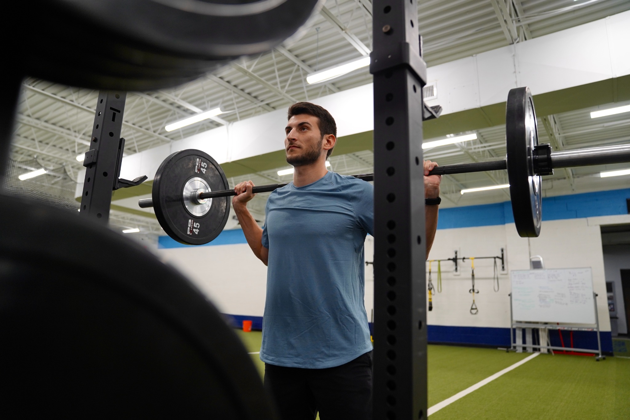 Dr. Pete Grasso coaching a strength exercise